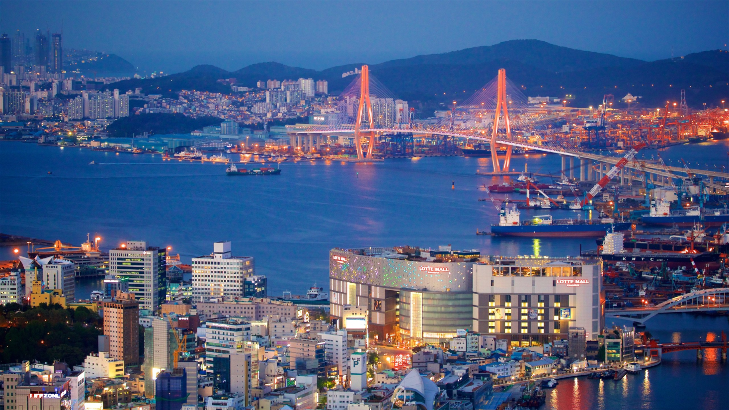 Fotografia aérea de Busan ao pôr do sol.